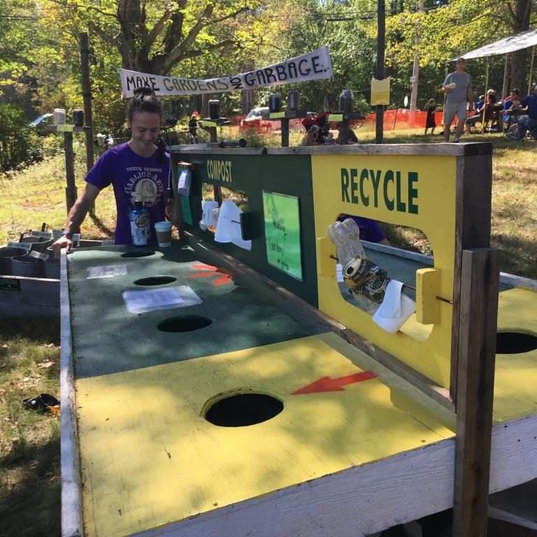 people at a food scrap collection station